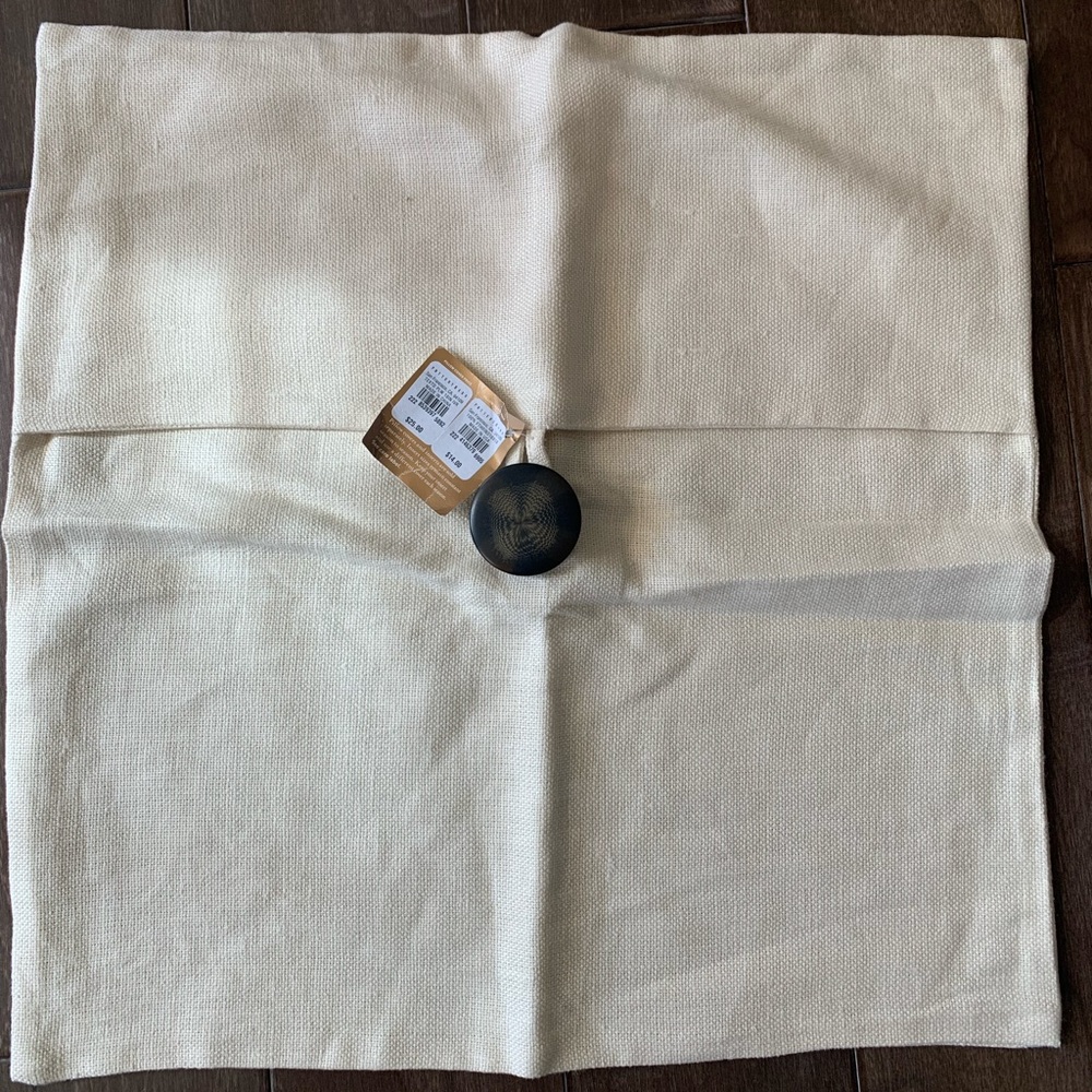 Pottery barn off white linen pillow with button.